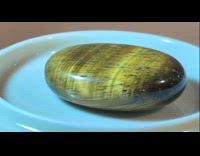 Tiger eye polished stone shows amazing chatoyance