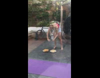 Girl takes photo of cheesecakes on ground 