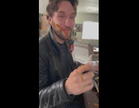 Couple eating hot sauce spilled all over them