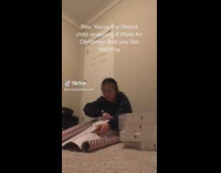 Girl wrapping ipad presents crying