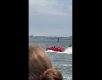 Man sails at river use red car