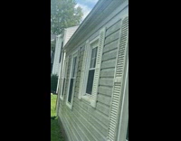 Horsefly fights the spider near the window