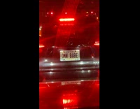 Collab WINY - Black car with OMW BABE license plate