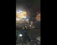 Guy dances in front of car backing up 