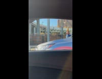 Guy stands still with pineapple on head 