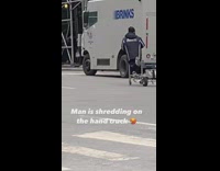 Delivery guy rides hand truck like its a scooter