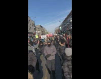 Peaceful protest people walk on street banners