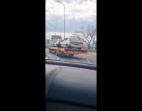 Car with broken trunk on the truck
