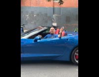 Collab WINY - Man in blue convertible sings to passerbys 