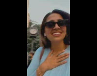 Clown with red hair on sidewalk 