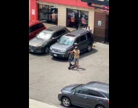 Man rides around scooter plays opera music