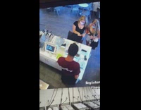 Cashier stands on tiptoes to look taller 