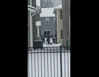 Man gray coat bag walk caught filmer