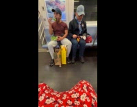 Men eat fruits and vegetables in train