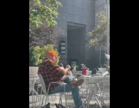 Guy plays with the birds at the park in morning 