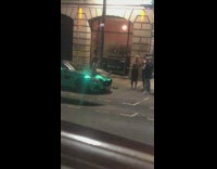 Woman silver dress sit over teal car