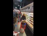 Guy rides onewheel inside crowded grocery store