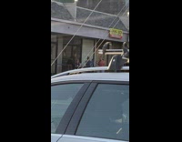 Woman pink top shows burger food for photoshoot