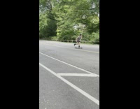 Guy riding skateboard does tricks turns around  
