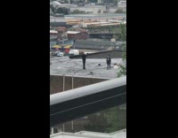 Guy black jacket walk rooftop video mountain