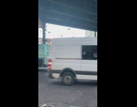 Guy rides a unicycle on the street 