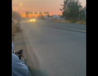 White car drifts and spins out 