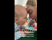 Mom and baby sings forehead touching together