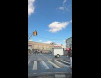 Man juggles pins at pedestrian stop light