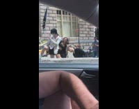 three girls dancing next to traffic 