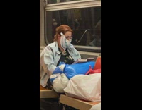 Woman wears scarf as face mask 