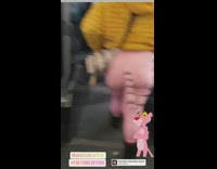 Lady on bus wears pink tiger bodysuit  