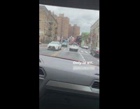 Car driving on road with a bunch of balloons