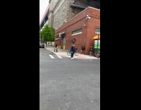 Collab WINY - Man ride bike balance tire on head Fedex truck