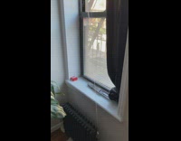 Broken radiator squirts water like a spout in apartment