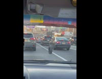 Car Tire Rolls Slowly on Road Traffic