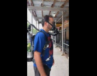 Man spins wearing plant tube and mask 