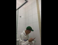 Guy uses mouth to hold toilet paper 