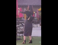 Woman takes picture of wine glass sunset