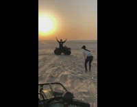 Guy on ATV poses at sunset