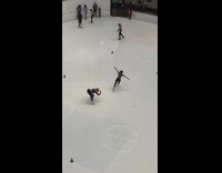 Woman ice skate dance in the middle of the ice rink