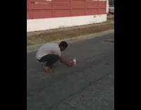 firework explodes in front of guy in white shirt