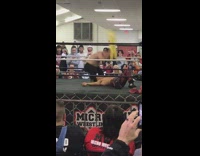 Micro wrestling event two guys referee ring