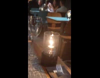 Woman take selfies at restaurant date night