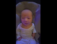 baby does not know if he will smile or cry