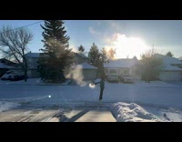 Man throw hot water on cold air