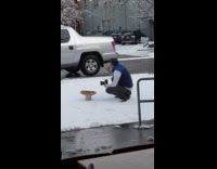 Guy blue vest pizza food snow car