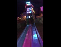 Mom rides fun slide at carnival fair 
