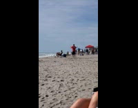 Guy red shirt teach karate video beach