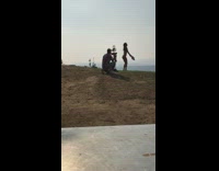 Collab IITW - Woman bikini dances with a fan at the park