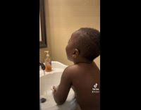 ClipsIG - Lady Catches boy Toddler Sing Gleefully with Soap as mic